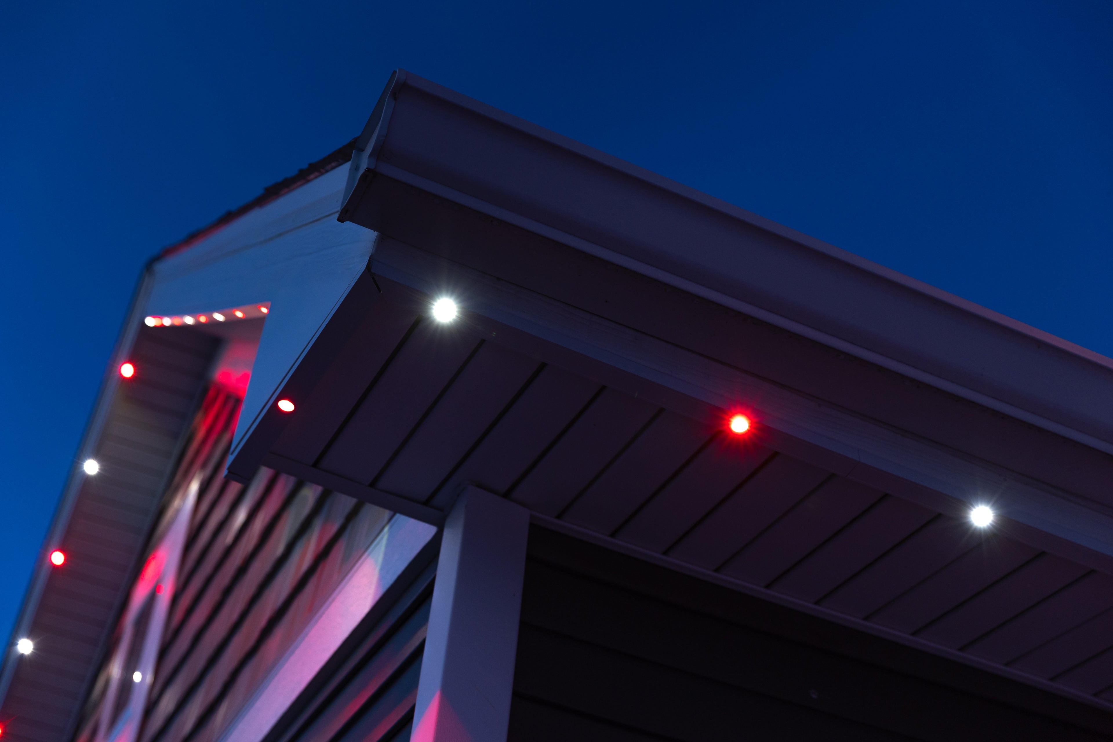 GlowTrax aluminum track installed on roofline with Govee permanent outdoor lights